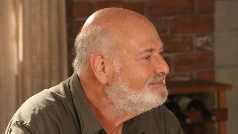 Rob Reiner faces right