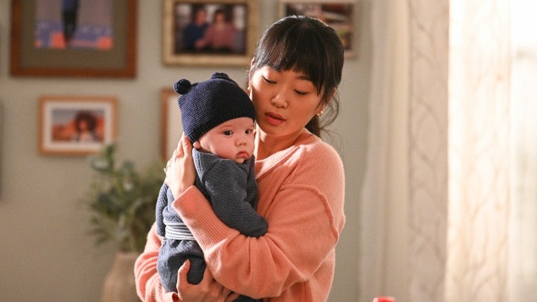 Alice Lee holds baby