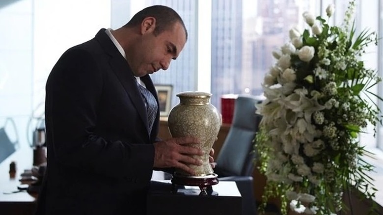Louis Litt holds Norma's ashes