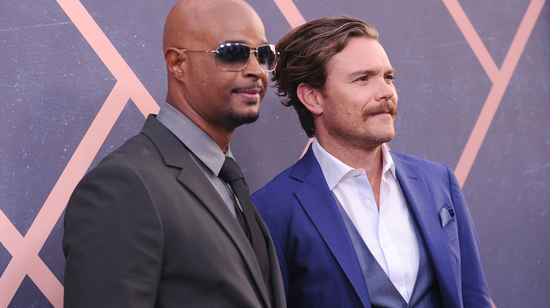 Damon Waynes poses for photos with Clayne Crawford