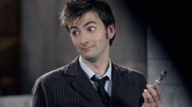 The Doctor holding sonic screwdriver