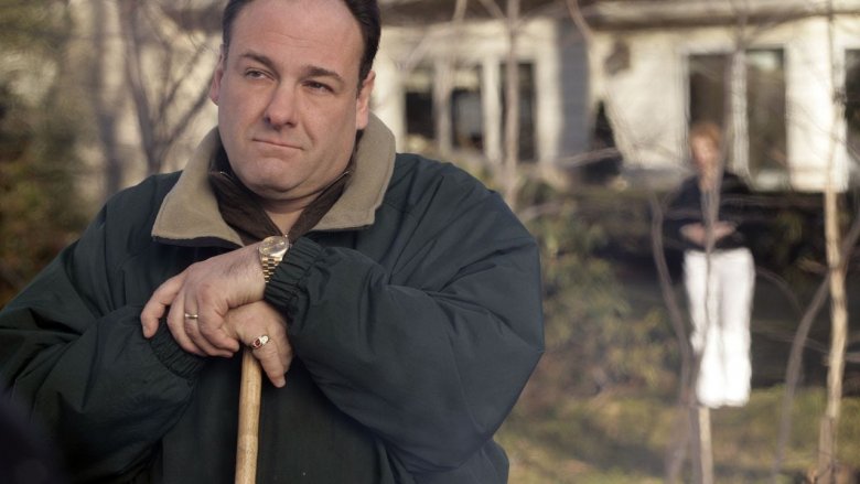 James Gandolfini as The Sopranos leaning on a shovel