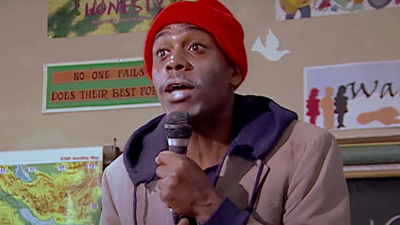 Tyrone Biggums holds a microphone