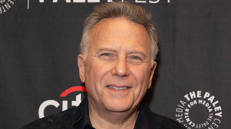 Paul Reiser smiles