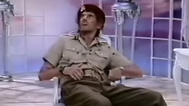 Colonel Gaddafi looking up