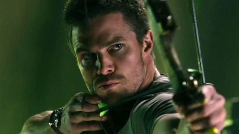 Oliver Queen shoots an arrow