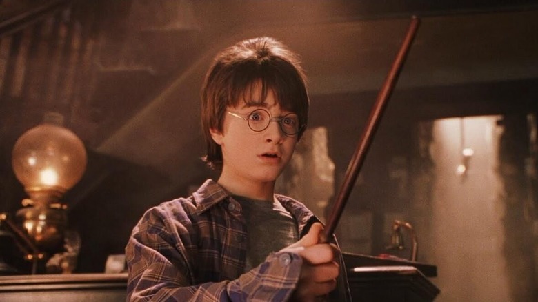 Harry Potter holding wand