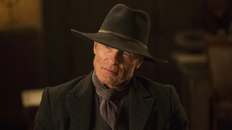 The Man in Black looks out from under his hat on "Westworld" (2016-2022)