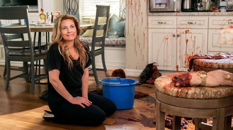 Sheila surrounded by body parts in "Santa Clarita Diet" (2017-2019)