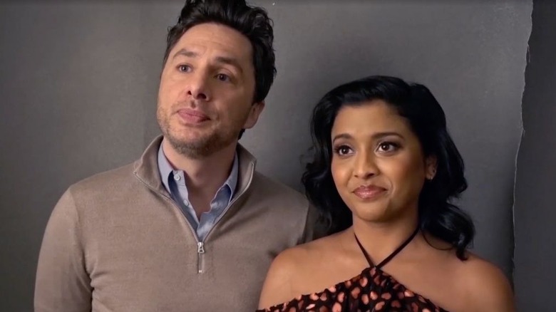  Zach Braff and Tiya Sircar look up