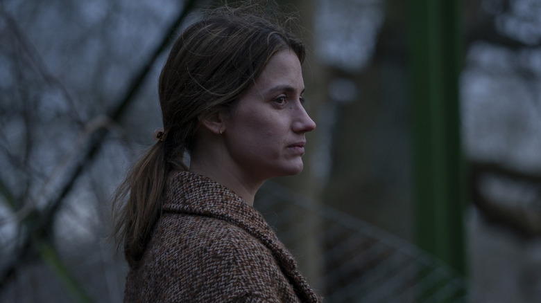  Danica Curcic standing by fence