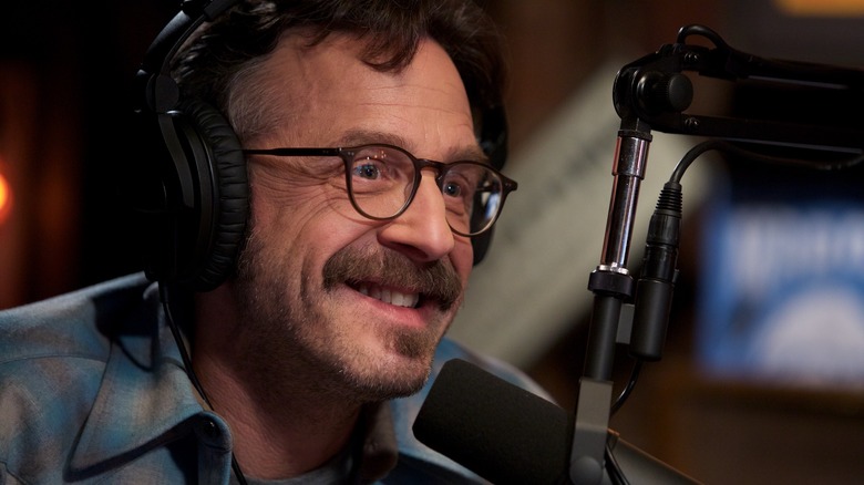 Marc Maron talking into microphone