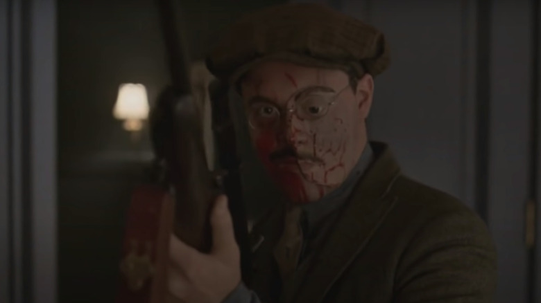 Richard Harrow covered in blood