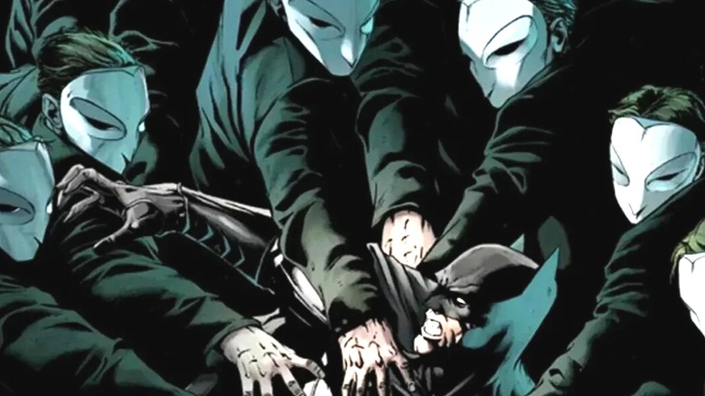 The Court of Owls grabbing Batman