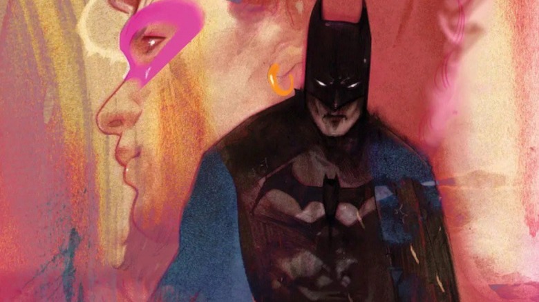 Batman looming in front of a woman's portrait