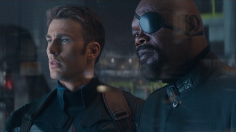 Captain America and Nick Fury look out a window