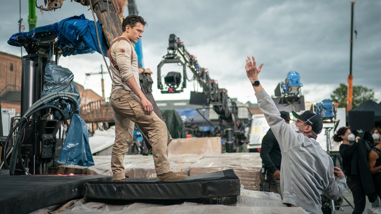 Ruben Fleischer directing Tom Holland on the set of Uncharted