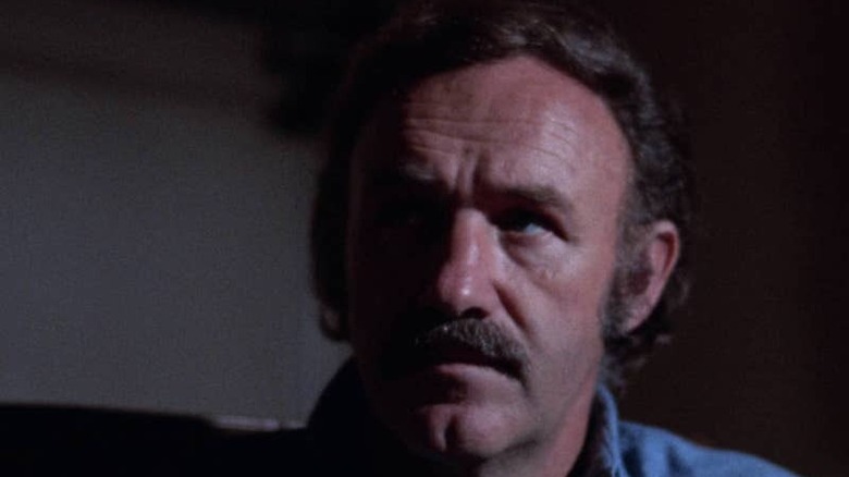 Gene Hackman sits in the dark