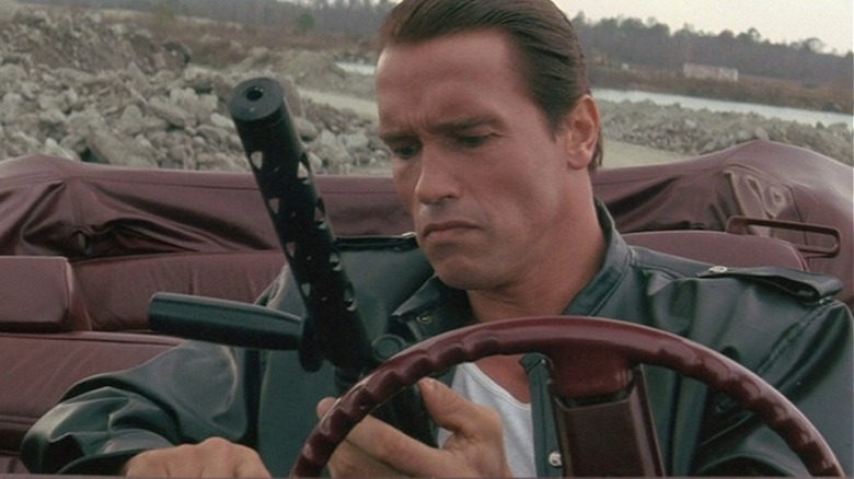 Arnold loads a gun