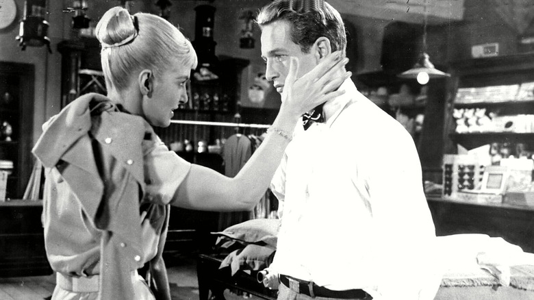 Joanne Woodward caresses Paul Newman