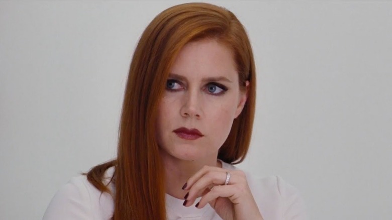 Amy Adams looks off-screen nervously