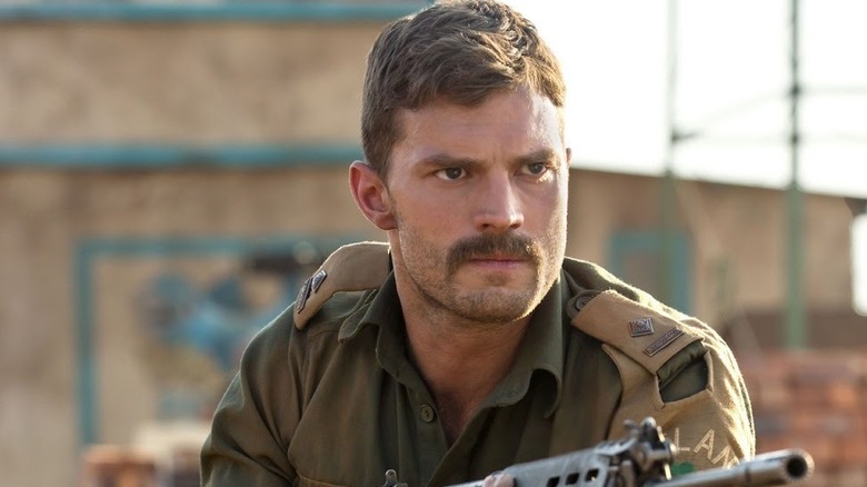 The Siege of Jadotville Jamie Dornan holds gun