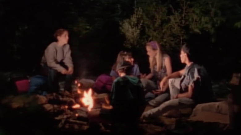 Midnight Society gathered around campfire