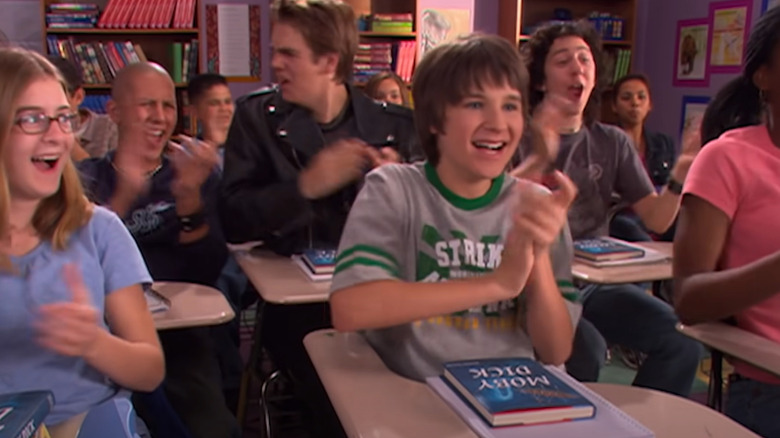 Ned Bigby applauding with classmates