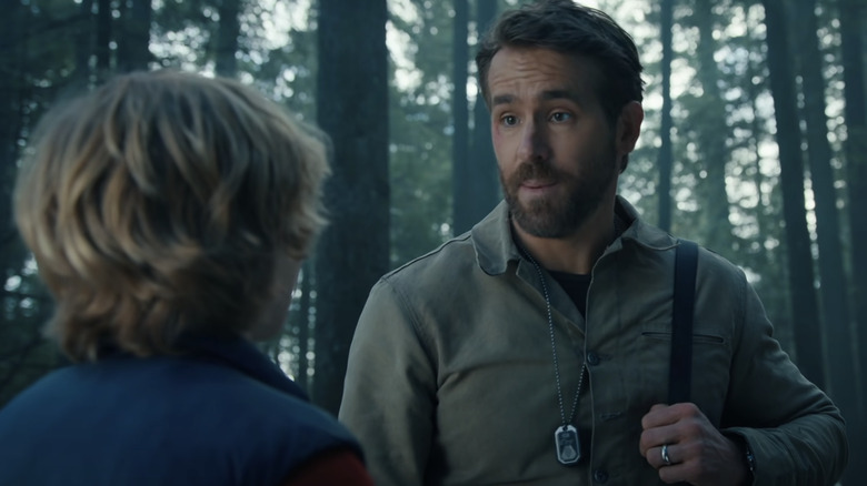 Ryan Reynolds and kid in forest