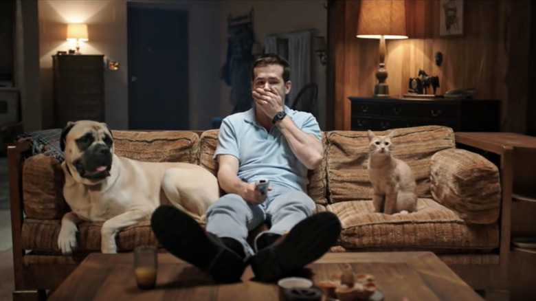 Reynolds with pets on sofa