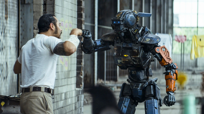 Chappie gives a fist bump to Amerika