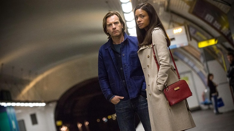 Perry and Gail stand on a subway platform