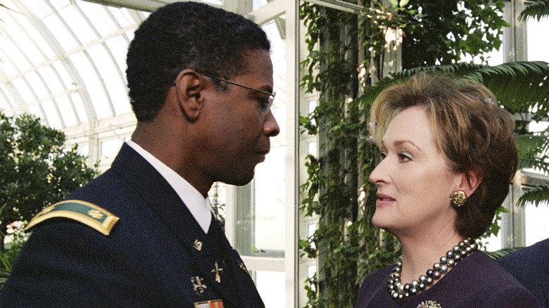 Bennett Marco and Eleanor Shaw stand face-to-face surrounded by trees