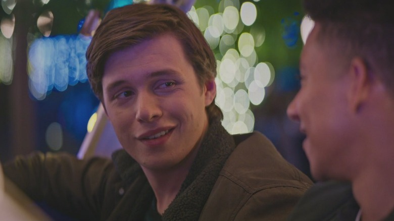 Nick Robinson smiles in Love, Simon