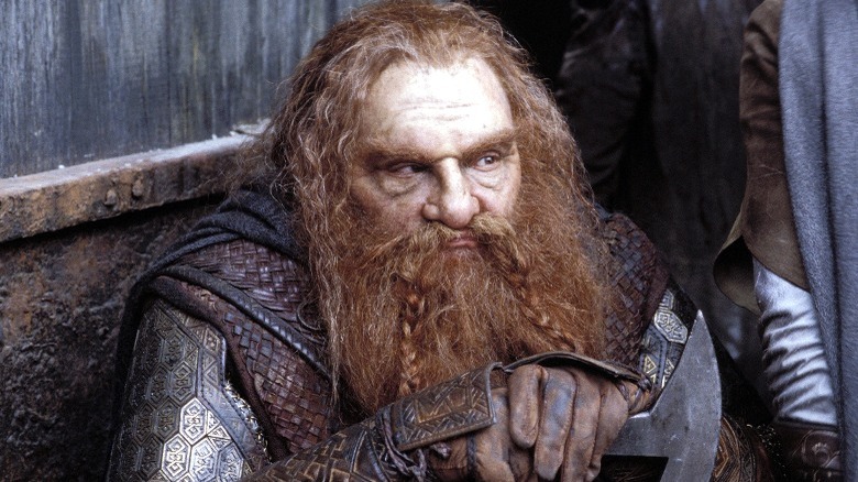 Gimli sitting with his axe