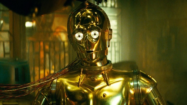 C-3PO being repaired