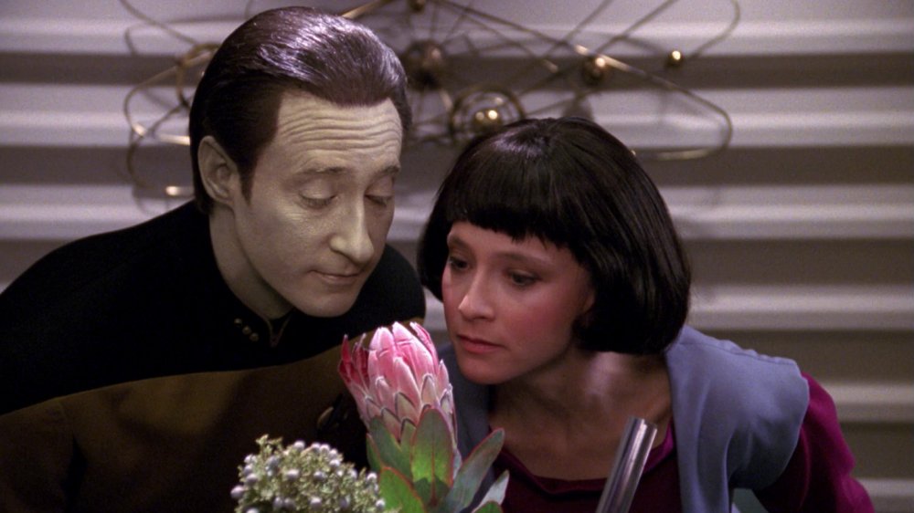 Lt. Comm. Data teaches his daughter, Lal, to stop and smell the roses