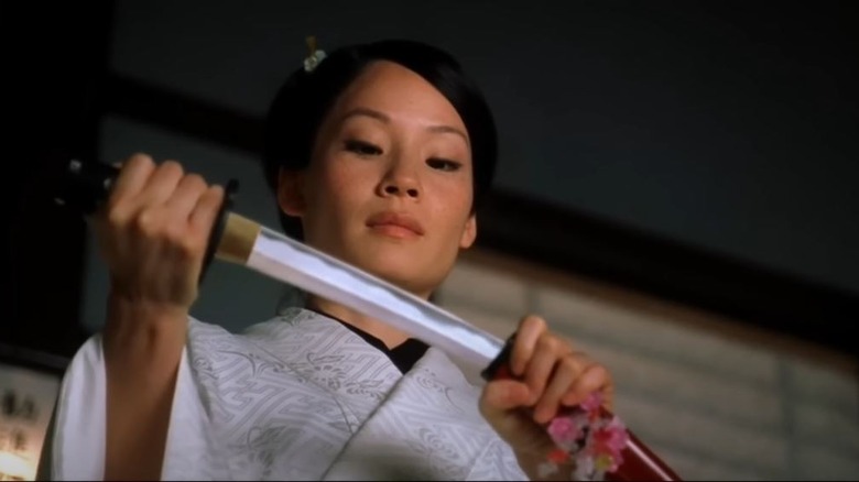 Lucy Liu drawing blade