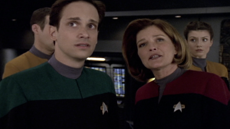 Janeway with three crew members