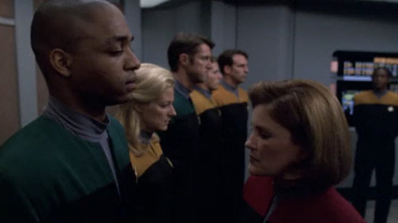 Janeway stands in front of Equinox crew