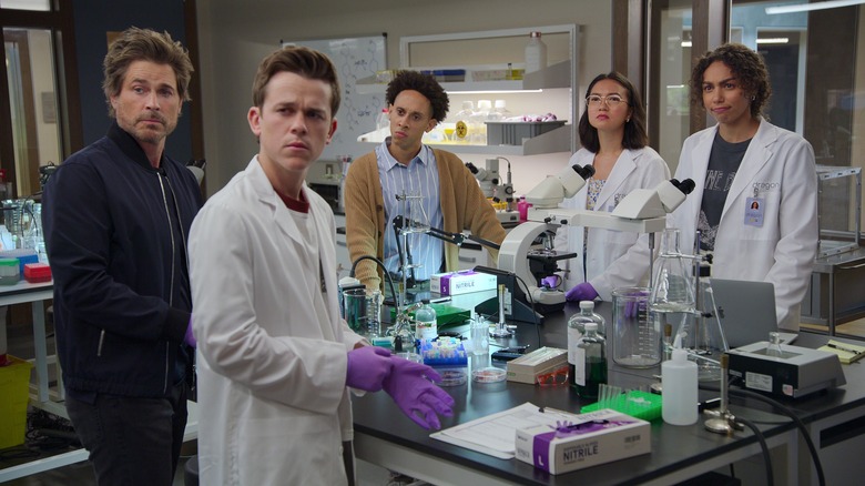 The cast of Unstable in lab coats