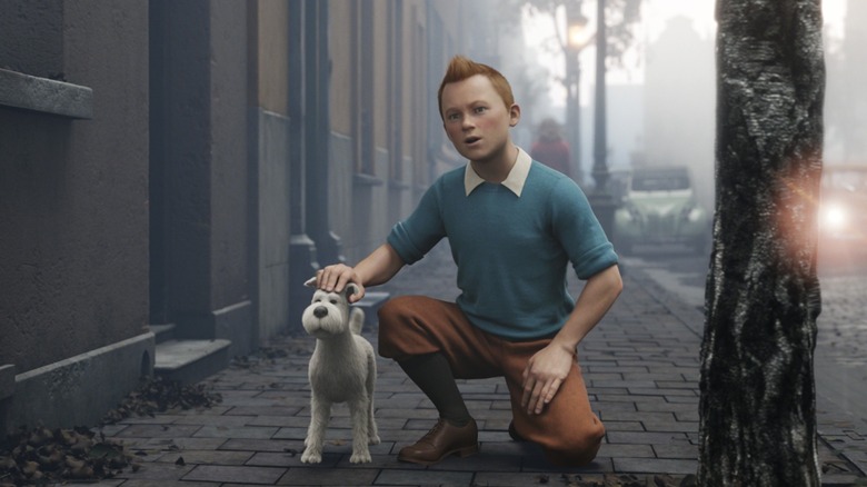 Tintin crouching and petting Snowy