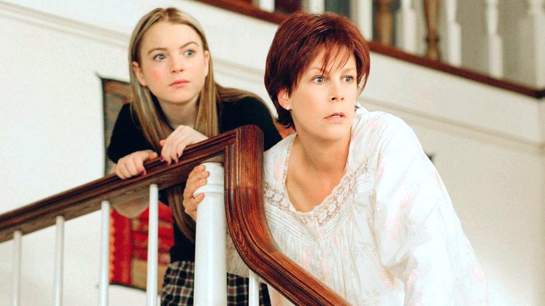 Tess and Anna Coleman holding stair railing