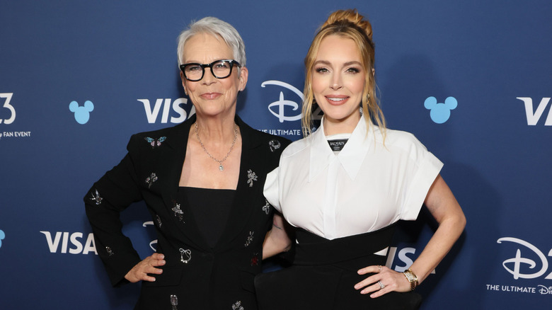 Jamie Lee Curtis and Lindsay Lohan posing together at D23 event