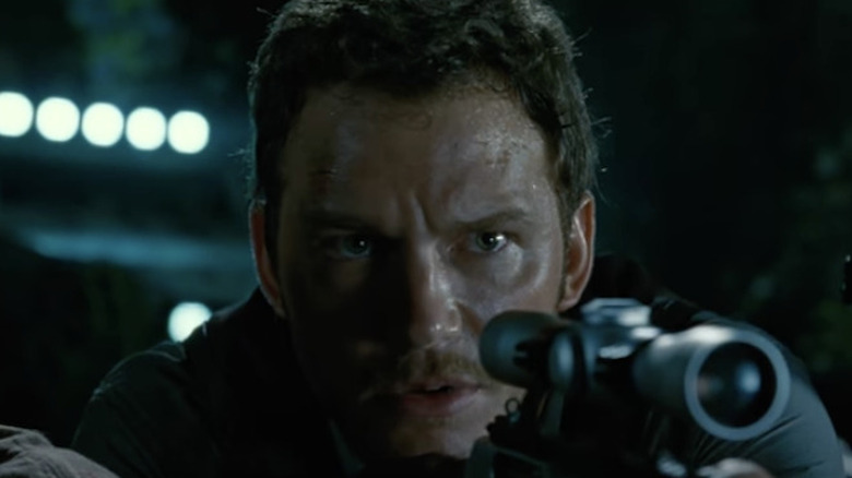 Chris Pratt with gun in Jurassic World