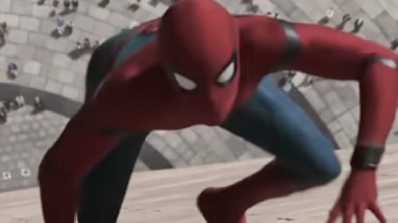 Tom Holland crawling building as Spider-Man in Spider-Man: Far From Home