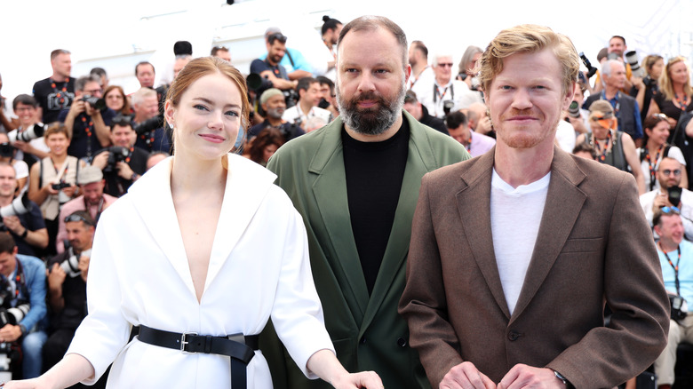 Emma Stone, Yorgos Lanthimos, and Jesse Plemons smiling