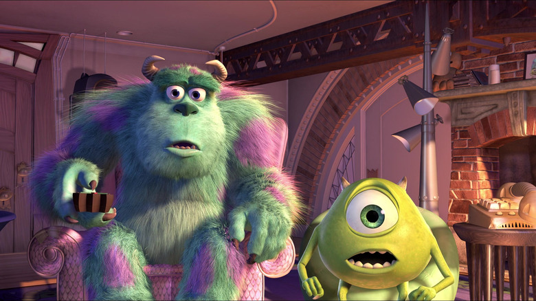 Sulley and Mike watching TV and looking shocked in Monsters Inc.