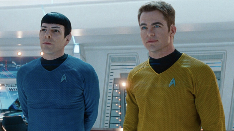 Kirk and Spock stand together