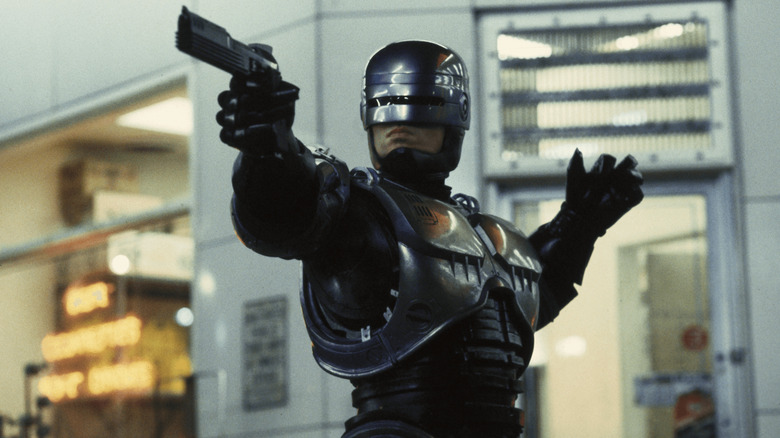 RoboCop pointing his gun